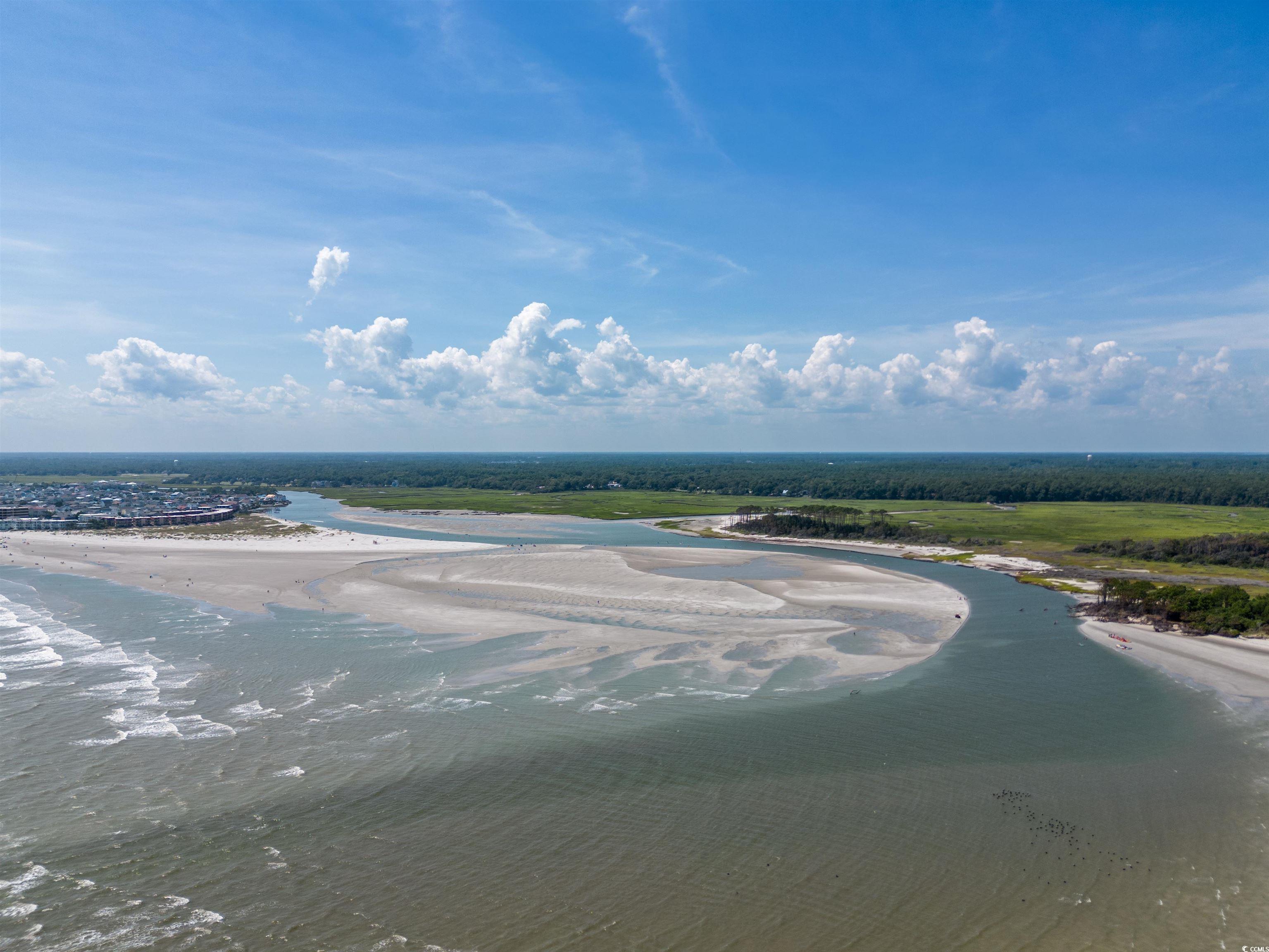 4675 Little River Neck Road North Myrtle Beach, SC 29582 - Photo 16 of 23 Drone / aerial view with a water view and a beach