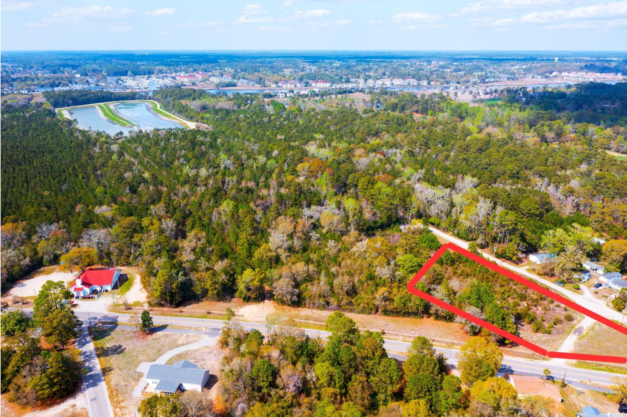 4675 Little River Neck Road North Myrtle Beach, SC 29582 - Photo 2 of 23 Birds eye view of property with a water view and a