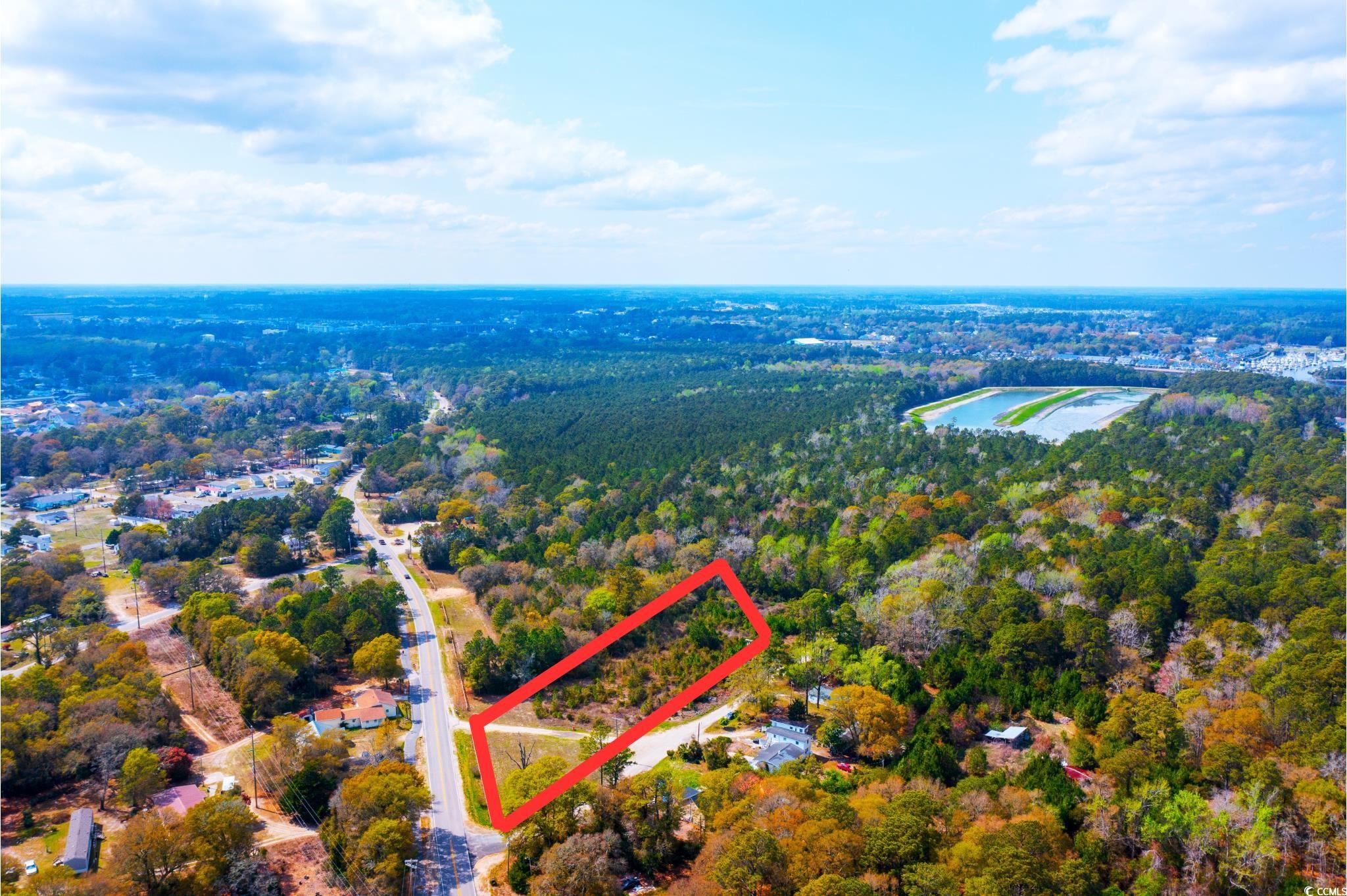 4675 Little River Neck Road North Myrtle Beach, SC 29582 - Photo 4 of 23 Aerial view with a view of trees