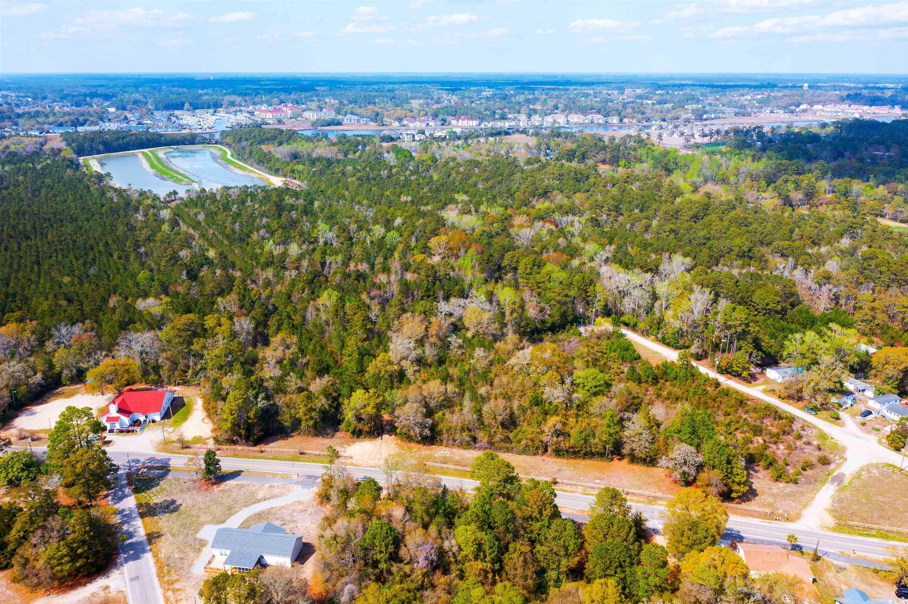 4675 Little River Neck Road North Myrtle Beach, SC 29582 - Photo 7 of 23 Birds eye view of property featuring a water view