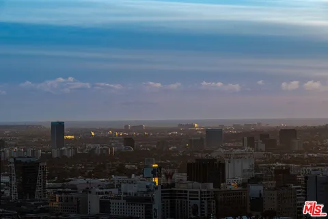 a bedroom with bed and a couch