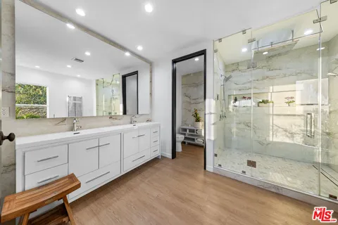 a bathroom with a bathtub and shower