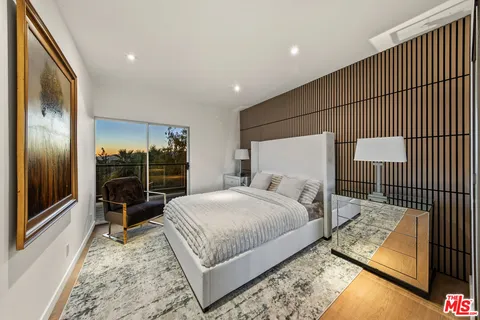 a bathroom with a double vanity sink and mirror