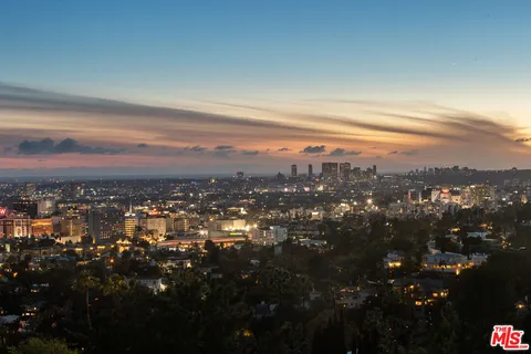 a view of a chairs and table in patio