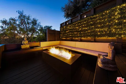 a view of balcony with furniture