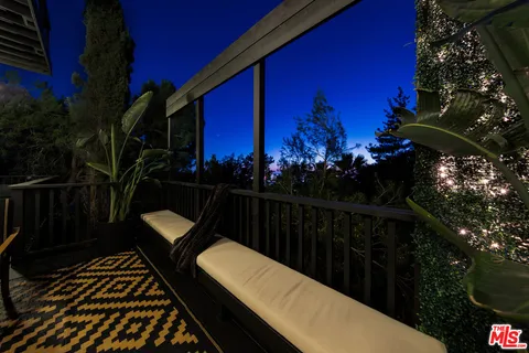 a view of swimming pool from a balcony