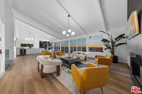 a view of a living room and kitchen view