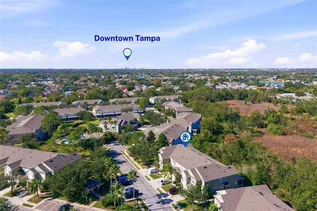 an aerial view of residential houses with outdoor space