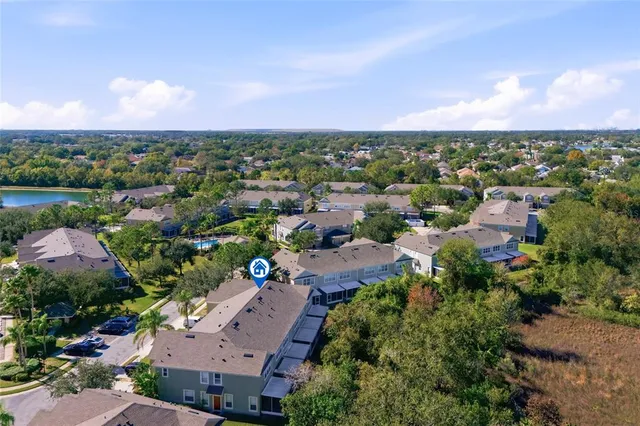 an aerial view of a houses with a street