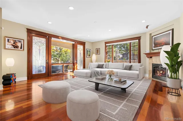 a dining room with wooden floor and a window