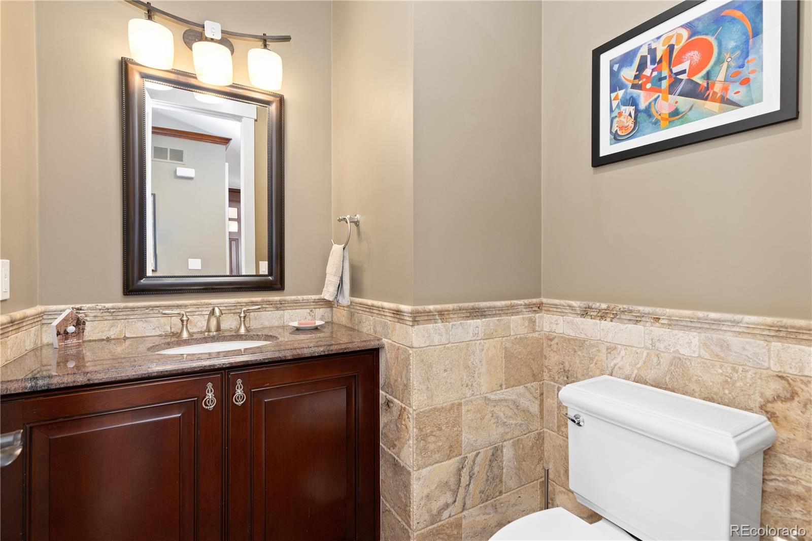 800 Grant Place Boulder, CO 80302 - Photo 16 of 50 a bathroom with a granite countertop sink mirror and toilet