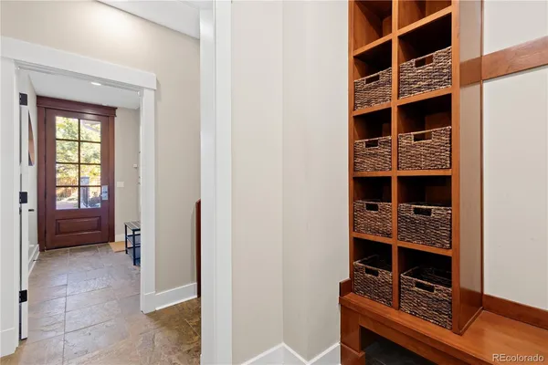 a living room with furniture a wooden floor and a window