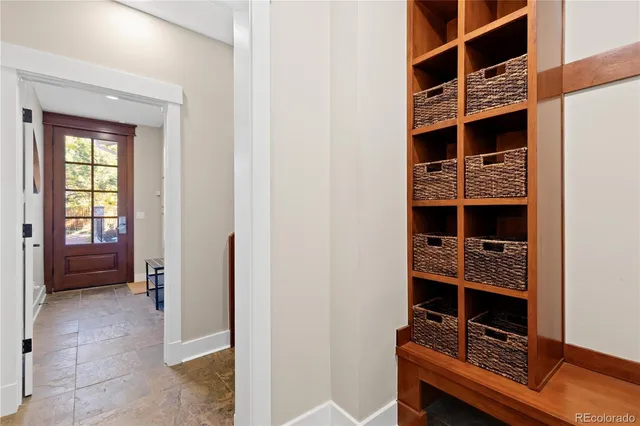 a living room with furniture a wooden floor and a window