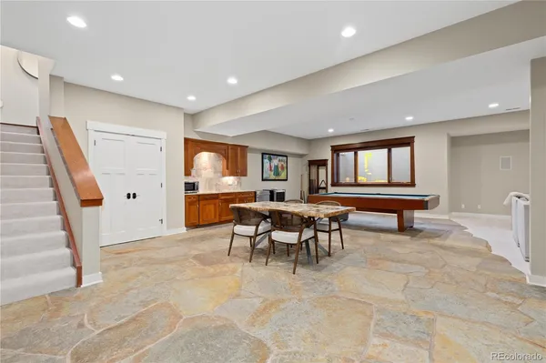 a hallway with a table and window