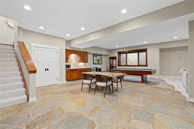 a hallway with a table and window