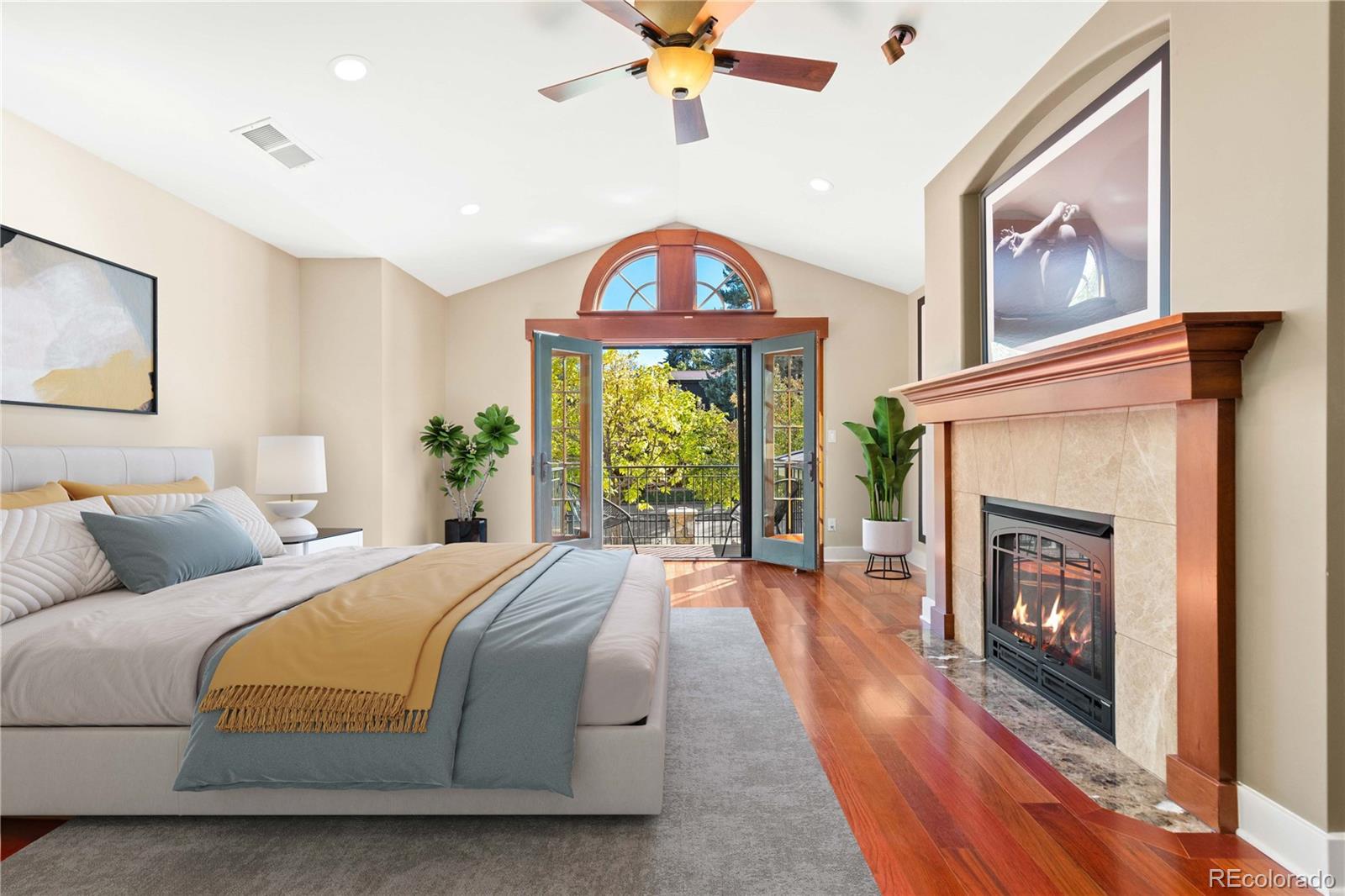 800 Grant Place Boulder, CO 80302 - Photo 28 of 50 a bed room with a balcony a bed and a fireplace