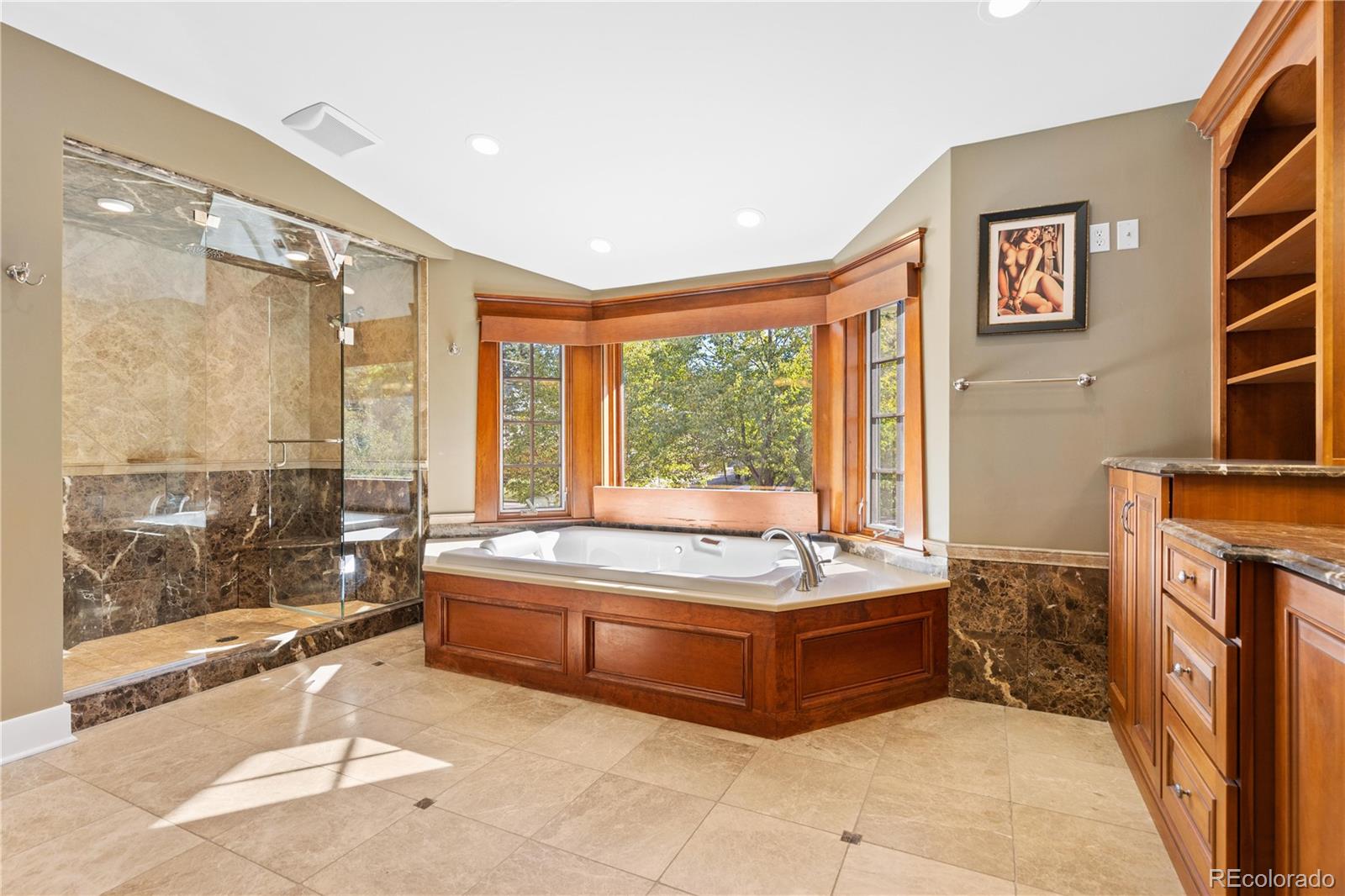 800 Grant Place Boulder, CO 80302 - Photo 31 of 50 a spacious bedroom with a bed and a window
