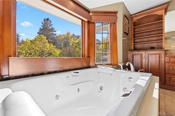 a bedroom with furniture and wooden floor