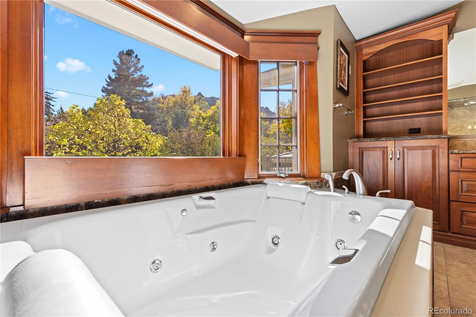 800 Grant Place Boulder, CO 80302 - Photo 32 of 50 a bathroom with a tub sink and mirror