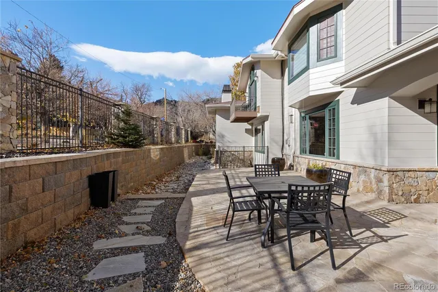 a view of a house with backyard porch and sitting area