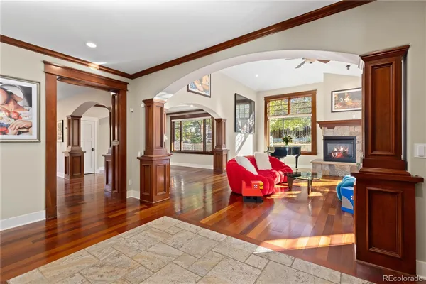a living room with furniture fireplace and window