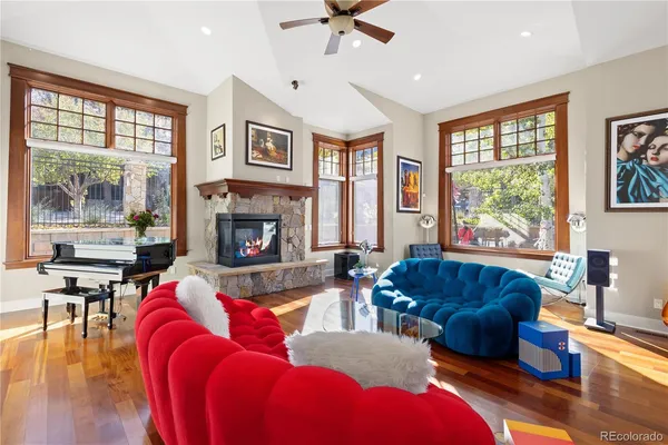 a living room with furniture and a fireplace