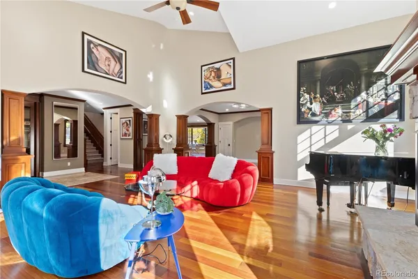 a dining room with furniture window and wooden floor
