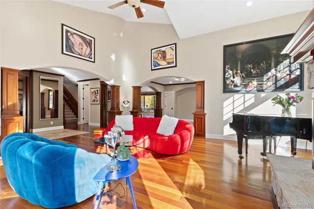 a dining room with furniture window and wooden floor