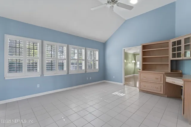 a room with window and furniture