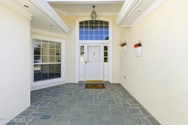 a kitchen with stainless steel appliances a stove microwave and sink
