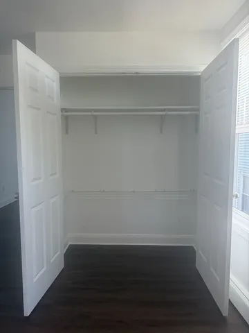 a view of an empty walk in closet