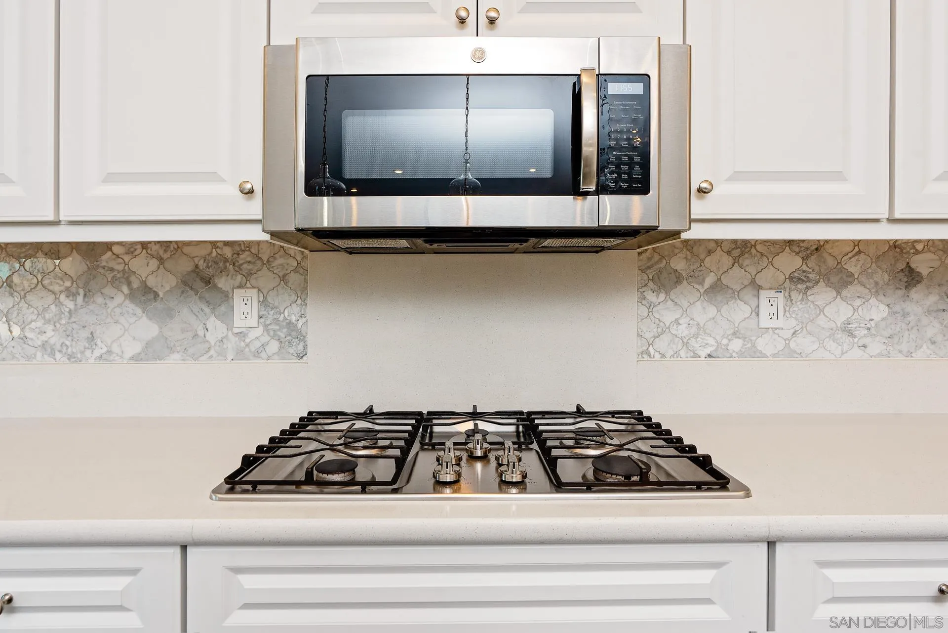 1712 Starlight Avenue Beaumont, CA 92223 - Photo 11 of 69 a stove top oven sitting inside of a kitchen