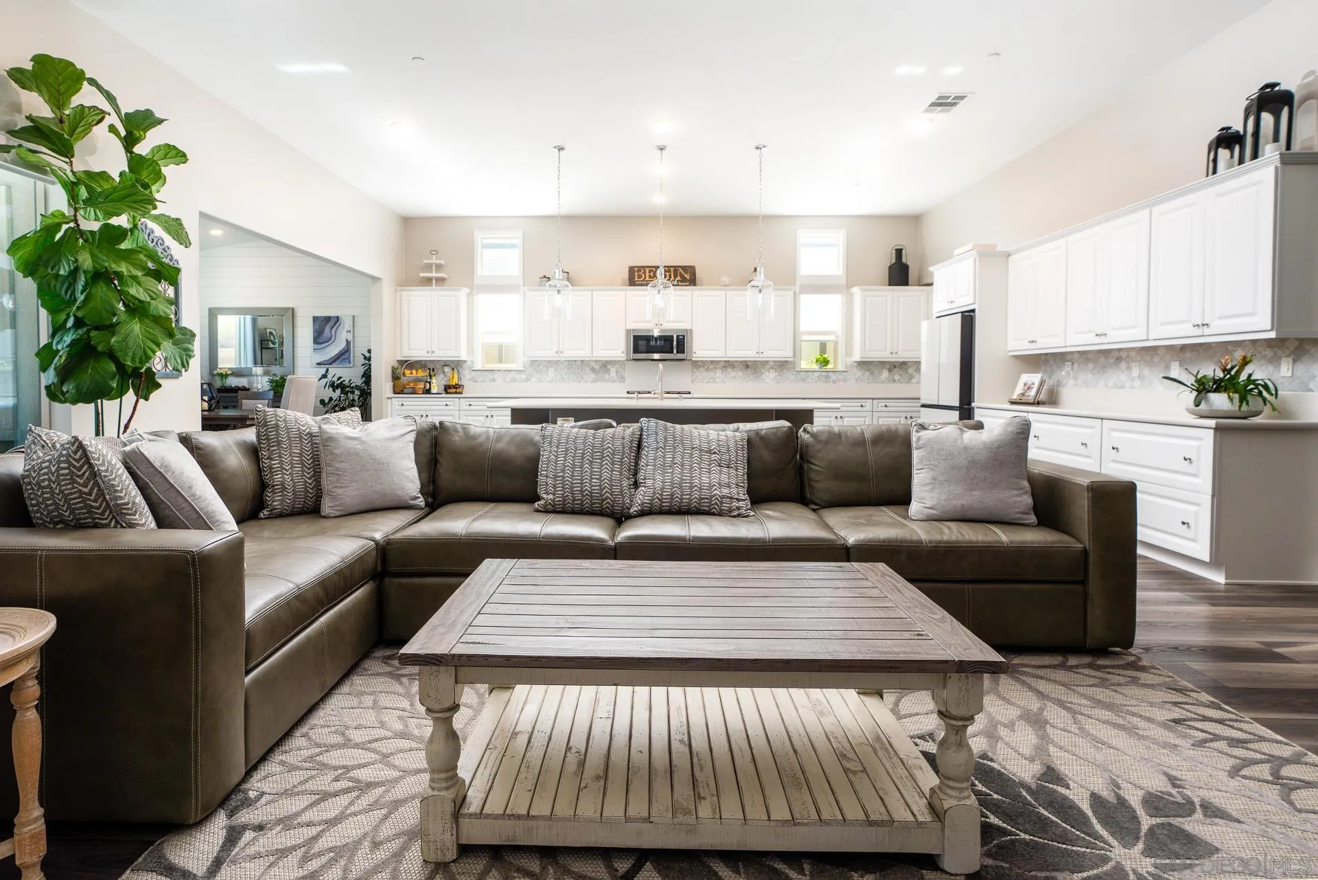 1712 Starlight Avenue Beaumont, CA 92223 - Photo 13 of 69 a living room with furniture and a potted plant