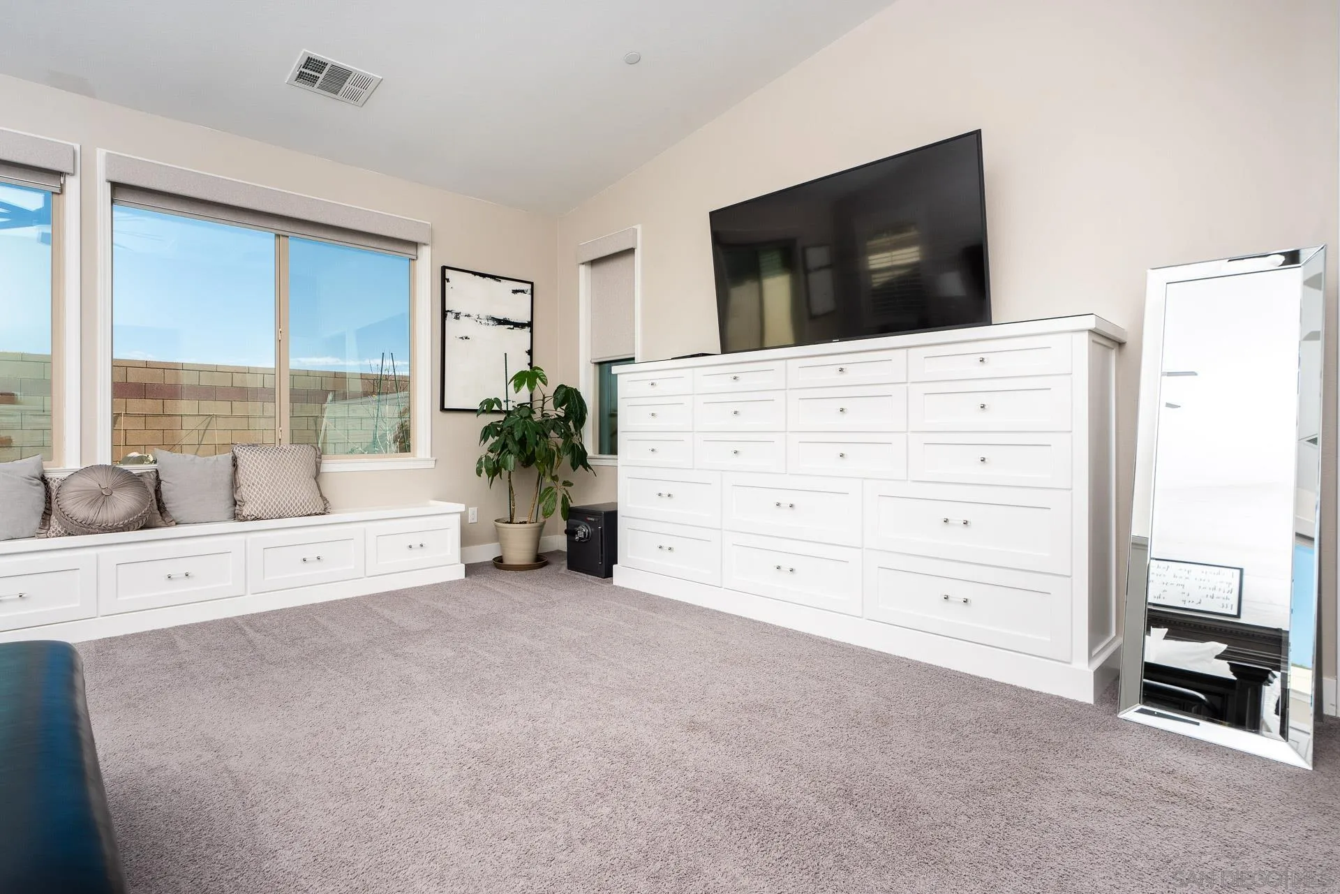 1712 Starlight Avenue Beaumont, CA 92223 - Photo 23 of 69 a living room with furniture and a flat screen tv