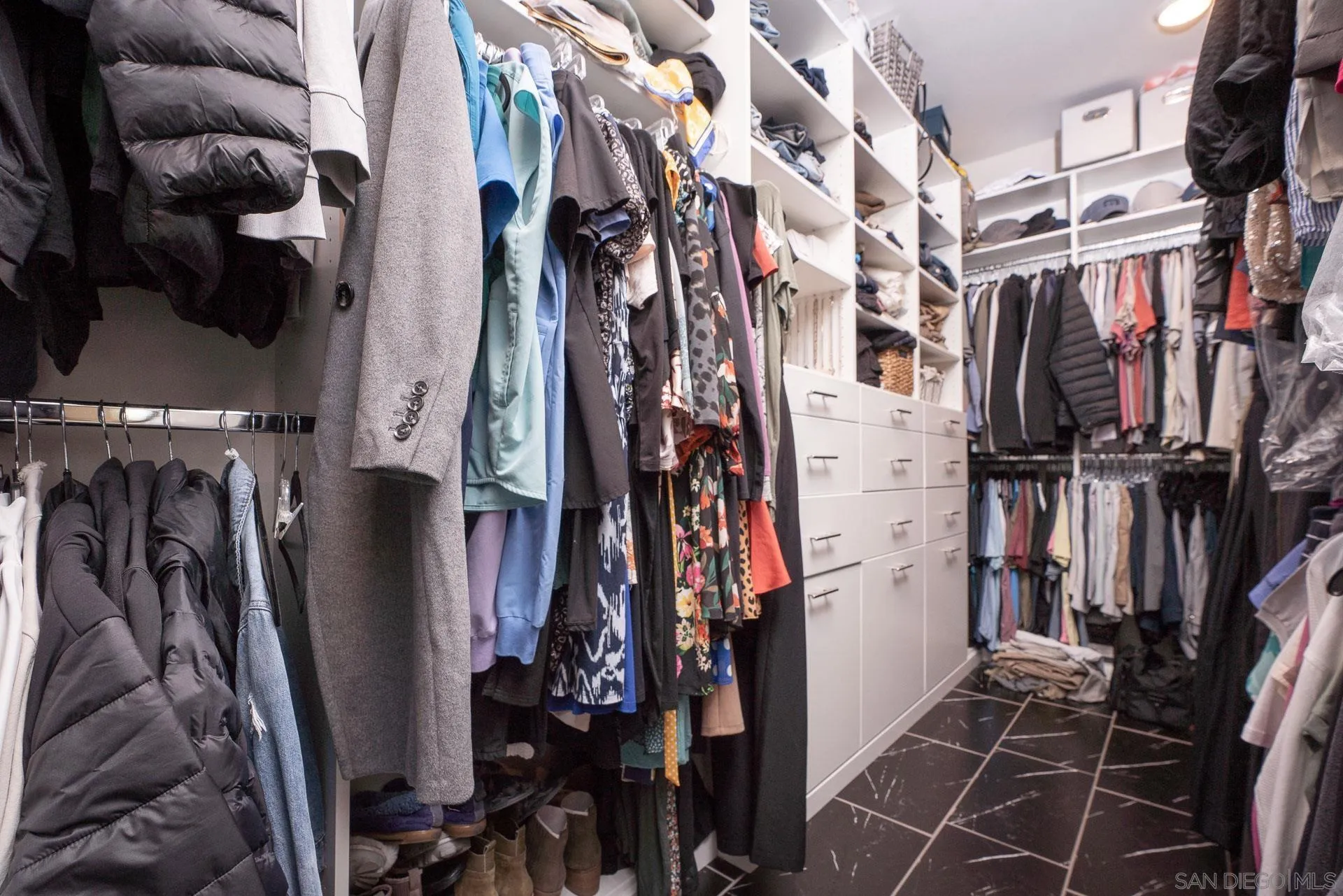 1712 Starlight Avenue Beaumont, CA 92223 - Photo 29 of 69 a view of walk in closet with clothes and shoes