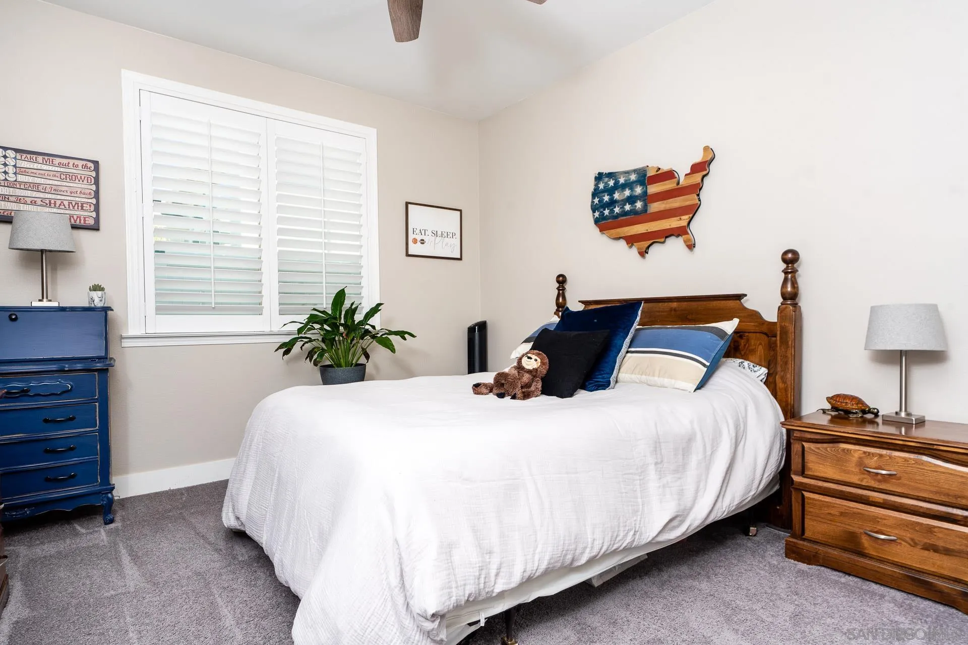 1712 Starlight Avenue Beaumont, CA 92223 - Photo 31 of 69 a bedroom with bed and a potted plant