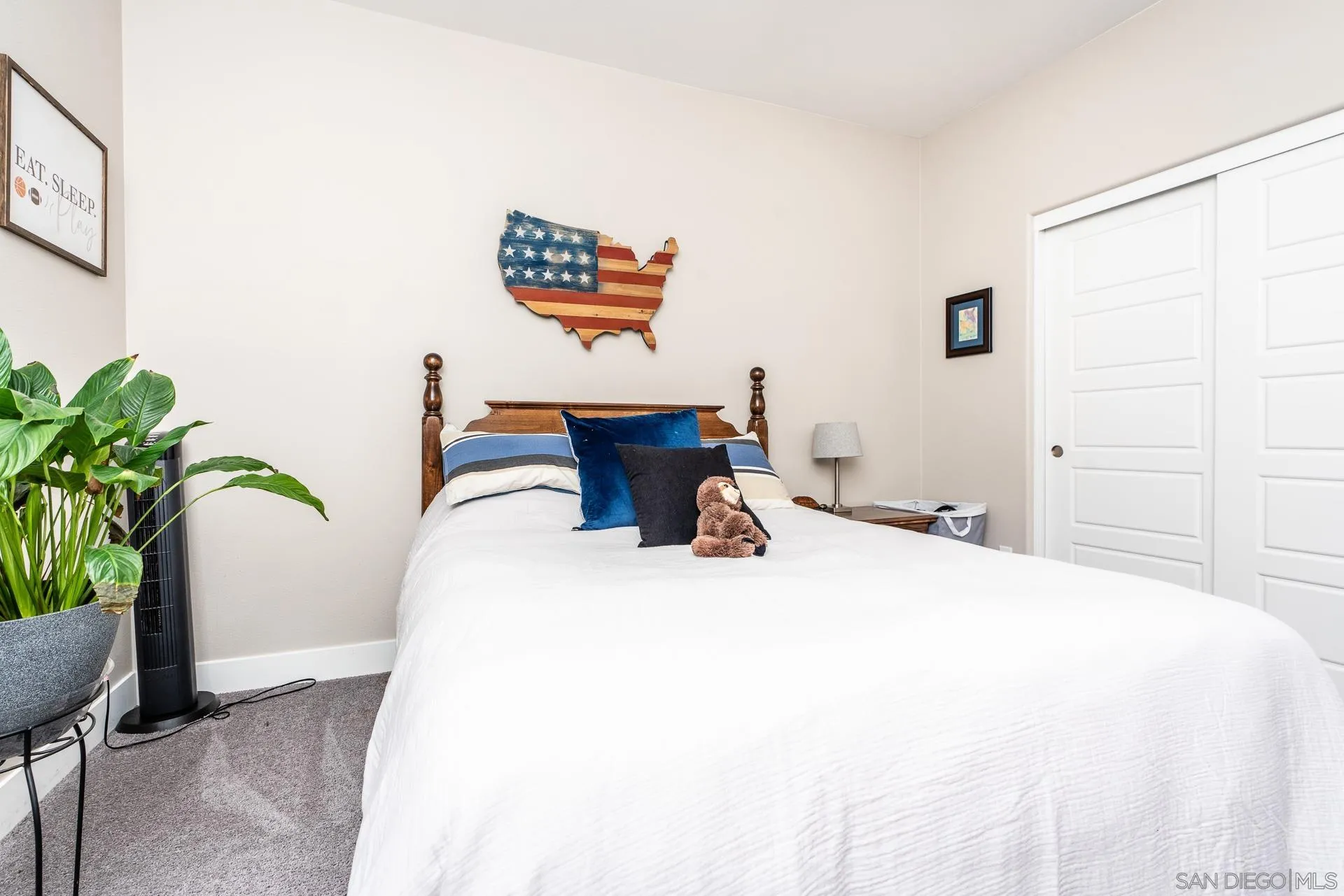 1712 Starlight Avenue Beaumont, CA 92223 - Photo 32 of 69 a bedroom with bed and a potted plant