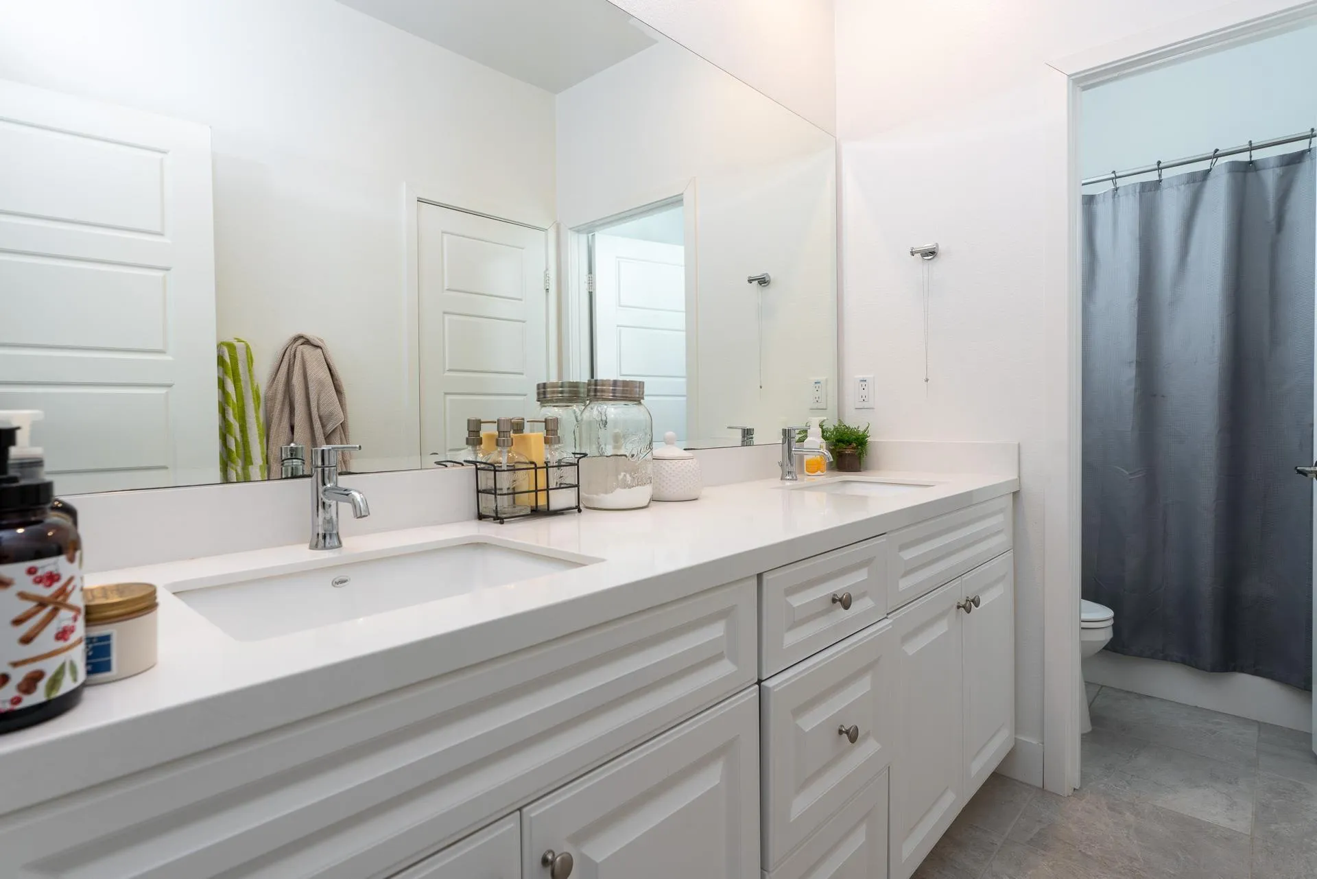 1712 Starlight Avenue Beaumont, CA 92223 - Photo 44 of 69 a bathroom with a double vanity sink and a mirror
