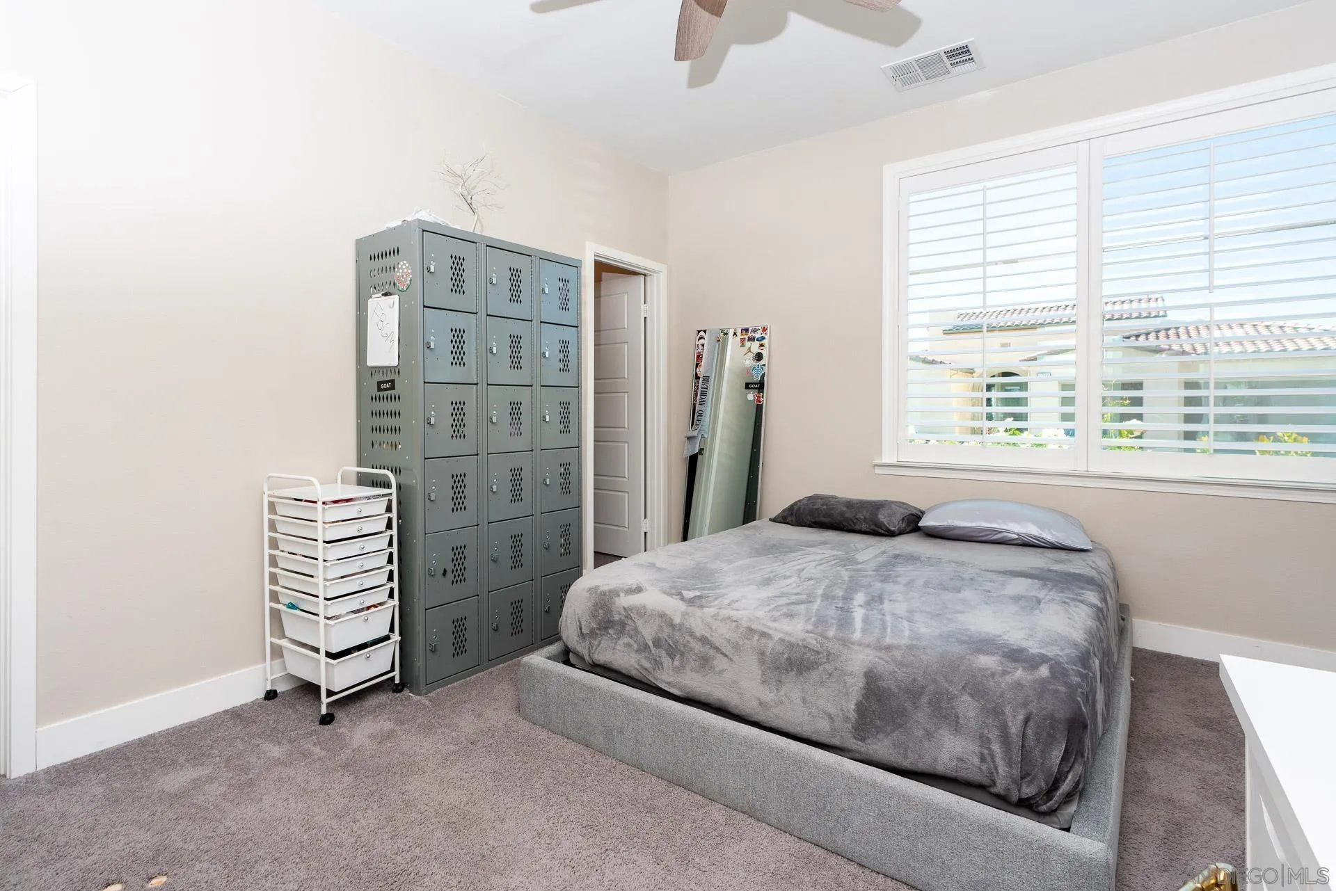 1712 Starlight Avenue Beaumont, CA 92223 - Photo 45 of 69 a bedroom with a bed and a window