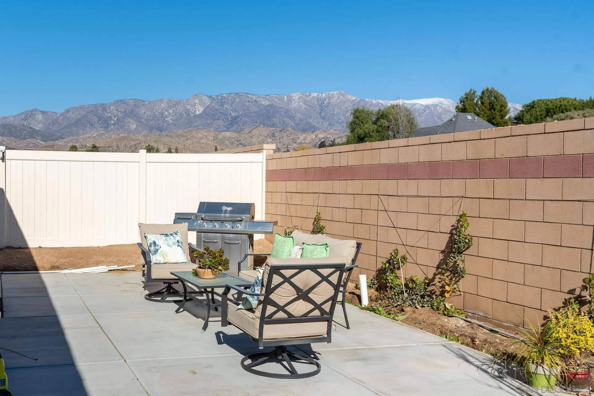 1712 Starlight Avenue Beaumont, CA 92223 - Photo 53 of 69 a view of a terrace with furniture and a table and chairs