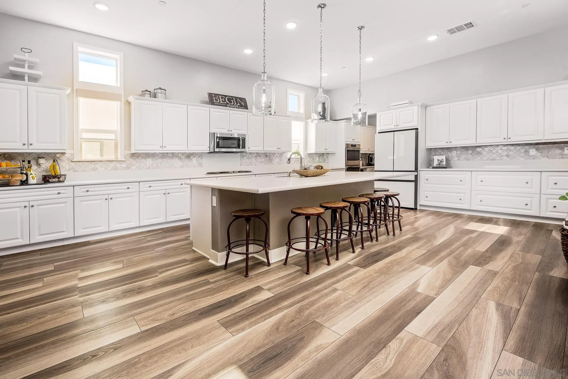1712 Starlight Avenue Beaumont, CA 92223 - Photo 8 of 69 a large kitchen with kitchen island a sink stainless steel appliances and cabinets