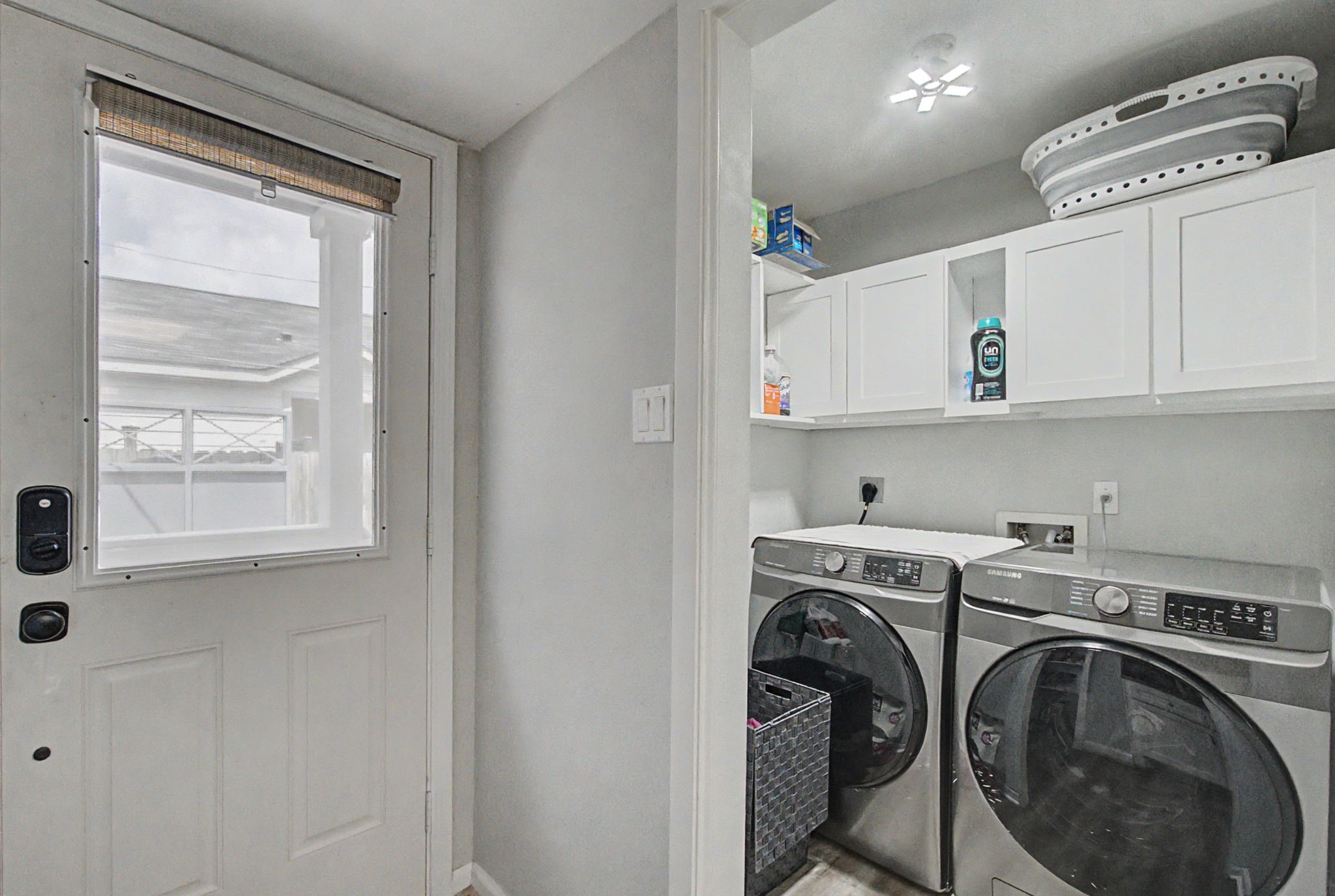 10034 Alfred Lane Houston, TX 77041 - Photo 21 of 50 Practicality meets style in this well-organized laundry room with built-in cabinetry.