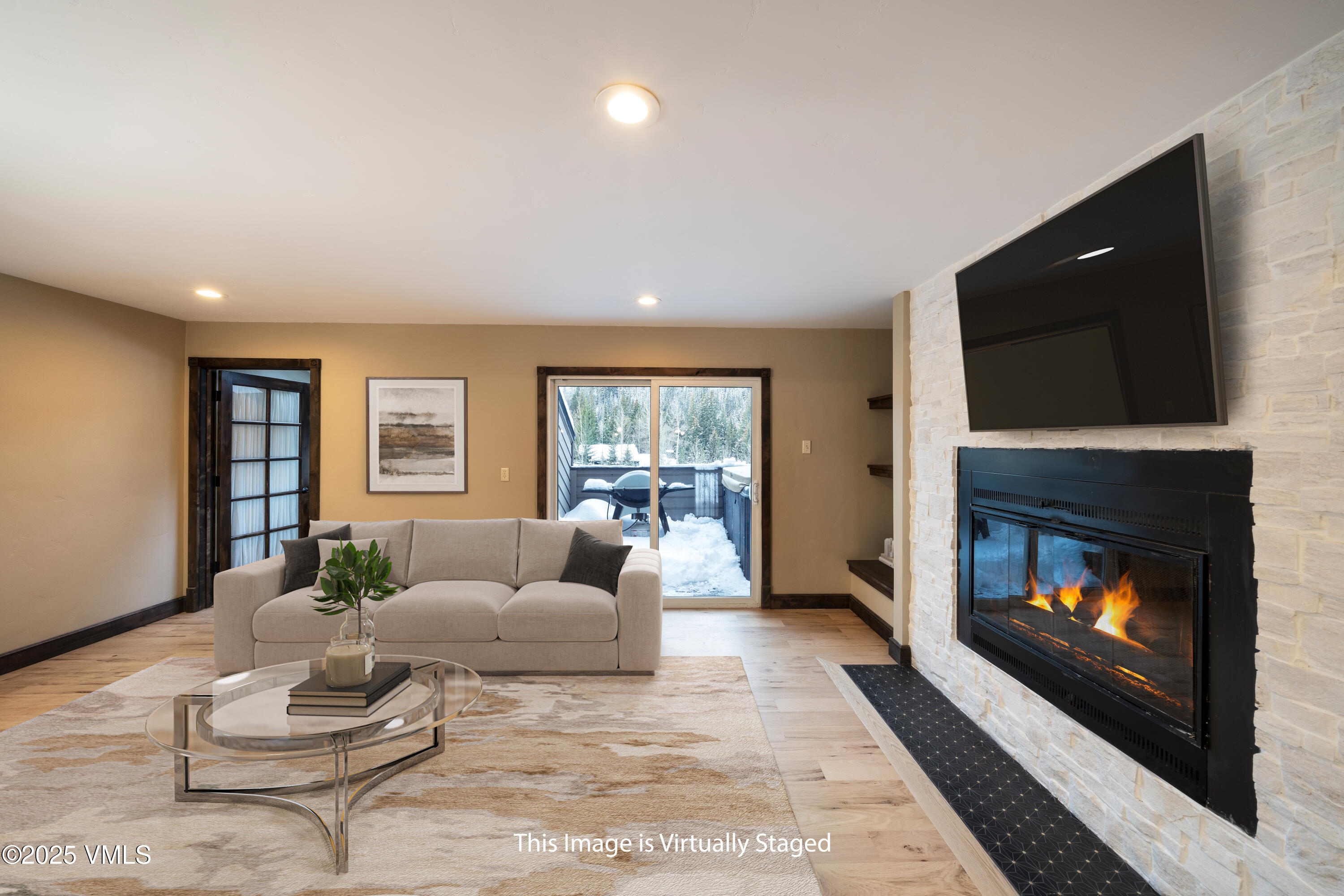 4595 Big Horn Road, Unit 5 Vail, CO 81657 - Photo 13 of 52 a living room with furniture and a fireplace