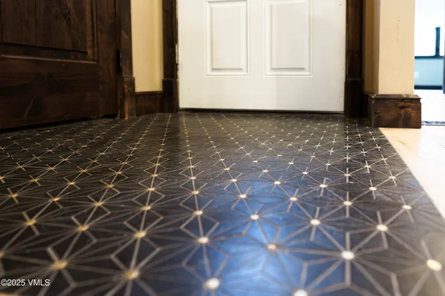 a roof deck with table and chairs