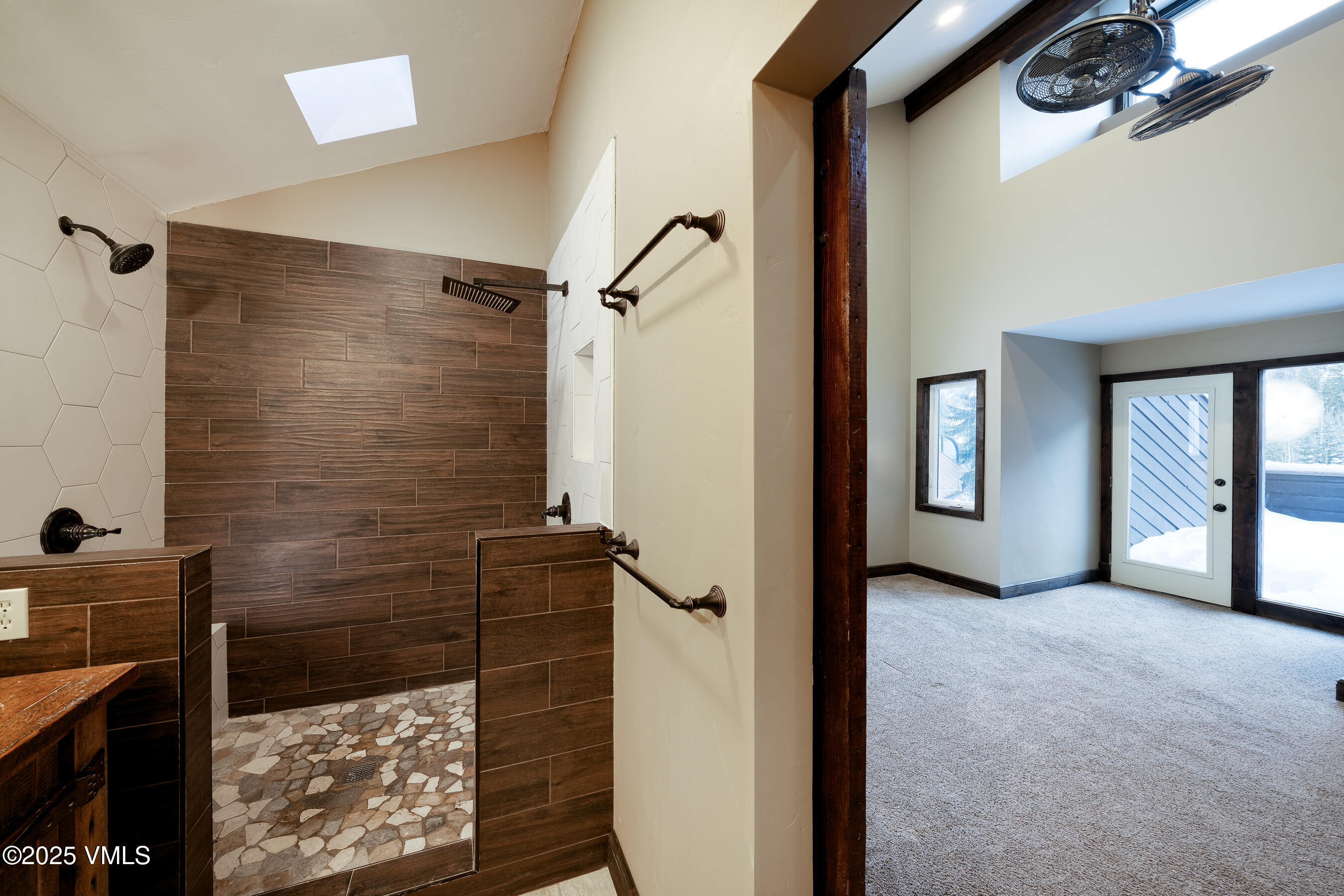 4595 Big Horn Road, Unit 5 Vail, CO 81657 - Photo 22 of 52 a view of a bathroom with a shower and a sink