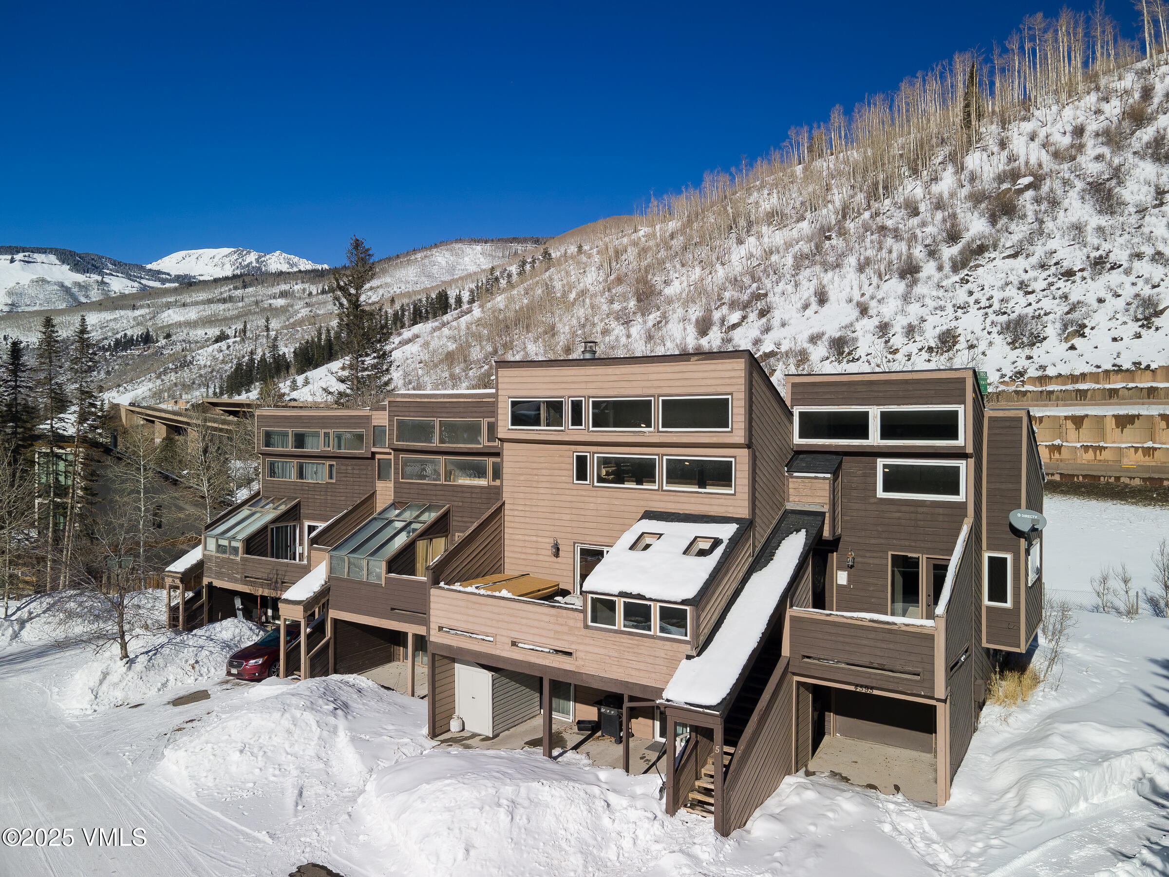 4595 Big Horn Road, Unit 5 Vail, CO 81657 - Photo 29 of 52 a roof deck with table and chairs