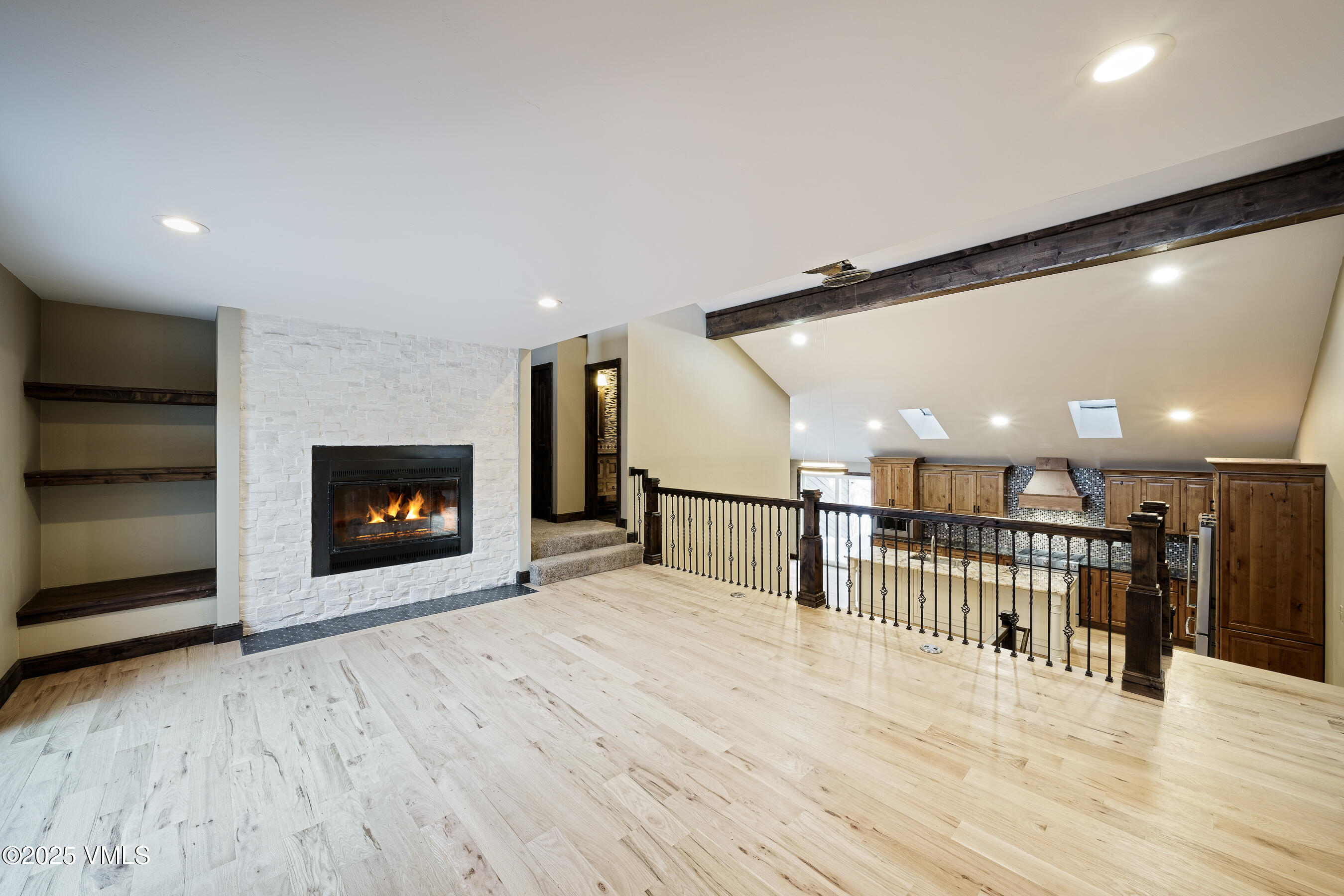 4595 Big Horn Road, Unit 5 Vail, CO 81657 - Photo 3 of 52 a view of a room wooden floor fire place and windows in a room
