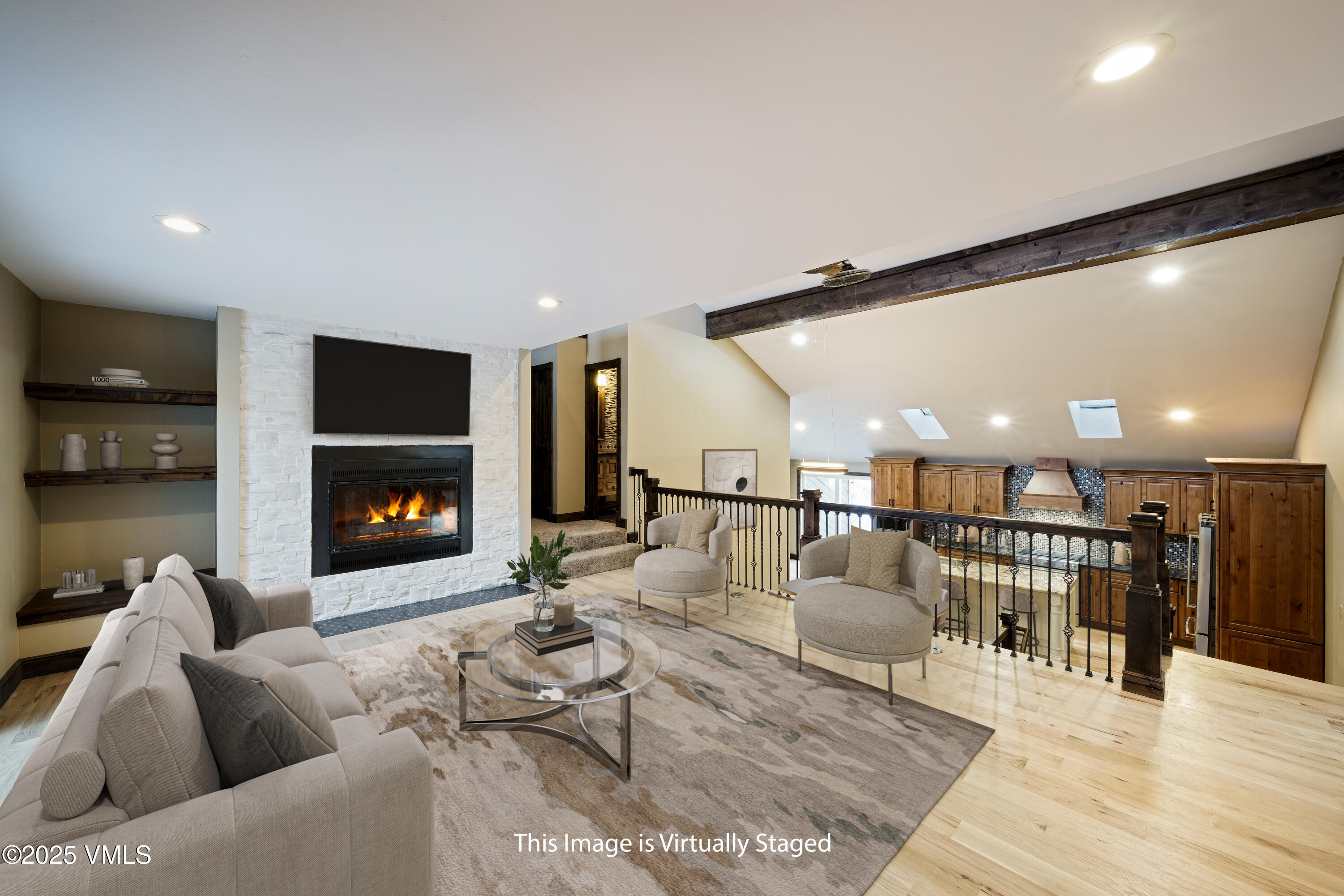 4595 Big Horn Road, Unit 5 Vail, CO 81657 - Photo 4 of 52 a living room with furniture a fireplace and a flat screen tv