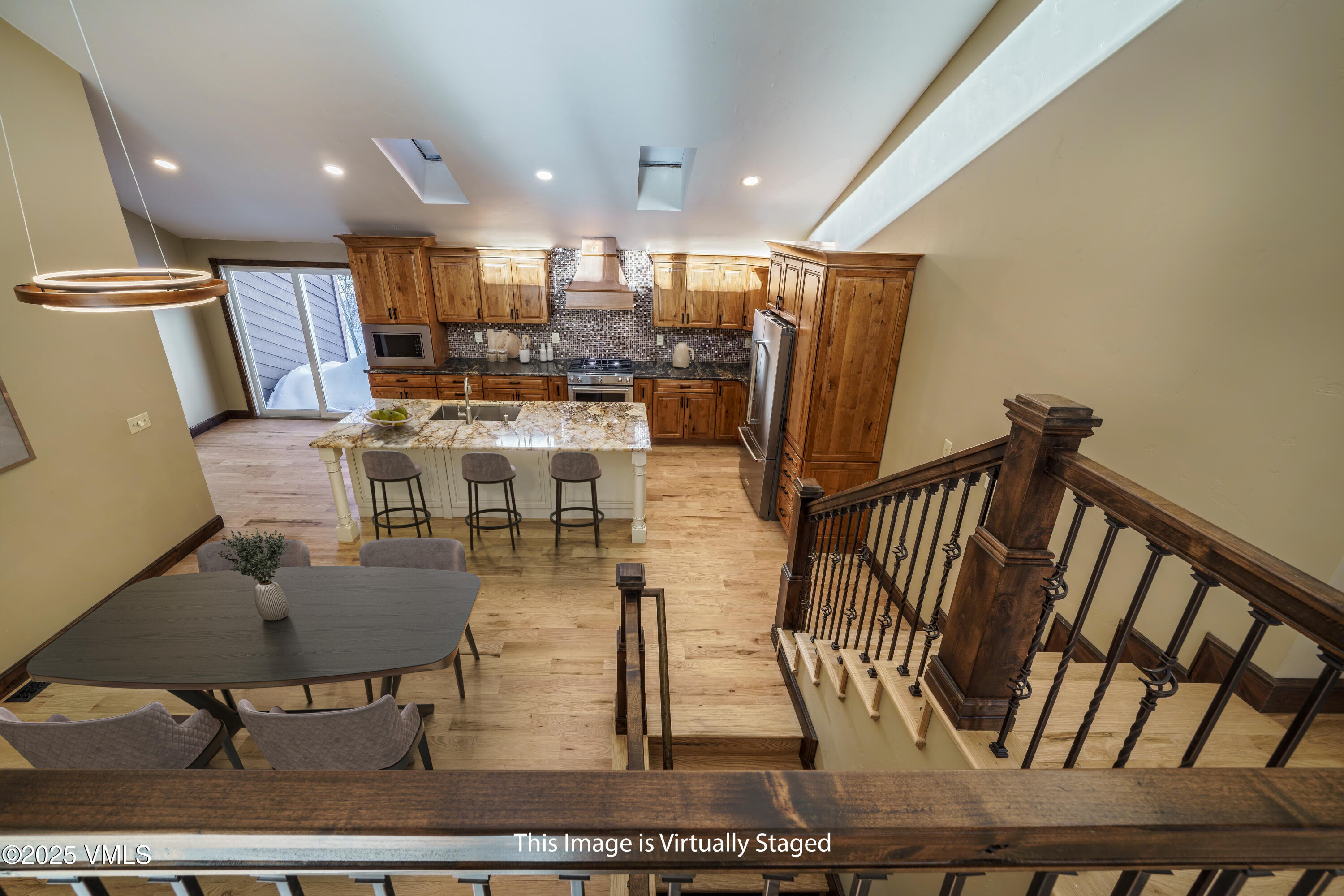 4595 Big Horn Road, Unit 5 Vail, CO 81657 - Photo 6 of 52 a living room with lots of furniture and a wooden floor