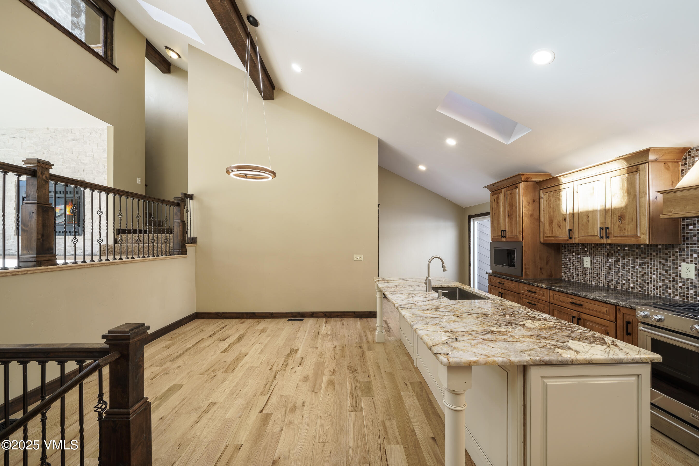 4595 Big Horn Road, Unit 5 Vail, CO 81657 - Photo 8 of 52 a kitchen with a sink and a refrigerator